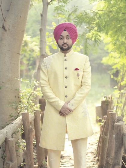 This groom looks dapper in our light yellow embroidered sherwani, a perfect choice for a daytime wedding. The subtle detailing and fit make it a popular rental choice.