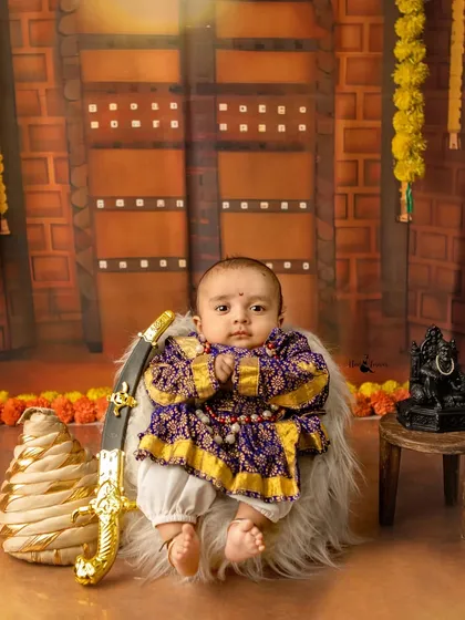 A tribute to our heritage with a Chhatrapati Shivaji Maharaj themed session. It fills me with pride to create these powerful portraits, complete with traditional attire and props like the tiny sword and turban, connecting the youngest generation to our history.