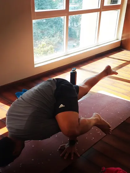 A student exploring a flying split variation (Eka Pada Koundinyasana). My workshops are for all levels, encouraging everyone to play with their limits.