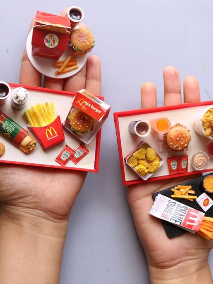 A collection of McDonald's meal trays, showing both veg and non-veg options.
