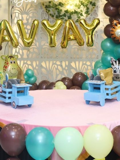 The truck-themed birthday favors set up at the party venue, surrounded by matching balloon decor.