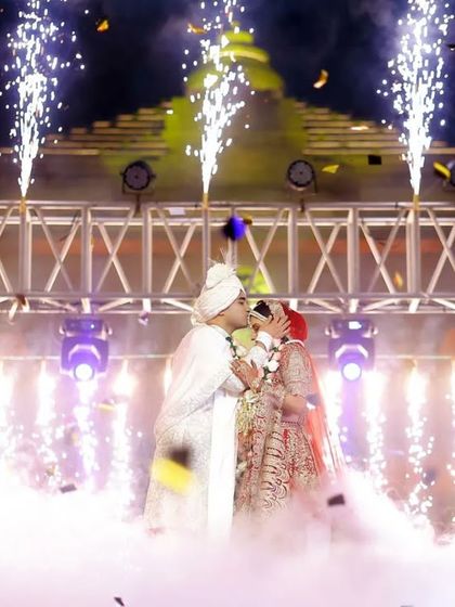 A kiss that seals the promise, surrounded by a shower of confetti and fireworks. We capture the peak emotional moments of your ceremony with dramatic flair.