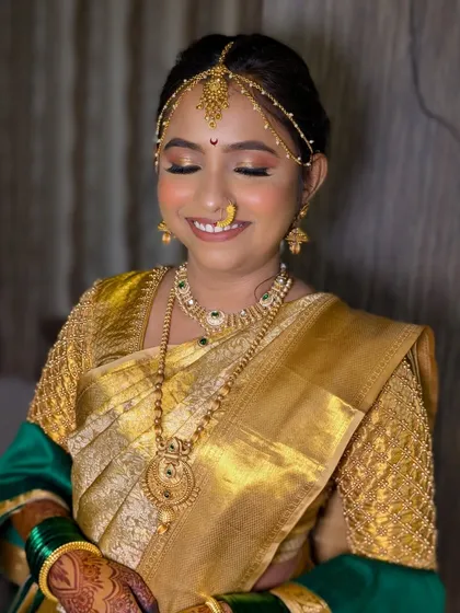 That happy bridal glow. The soft, shimmery eye makeup and neutral tones brought out Dhanashree's joy on her big day.