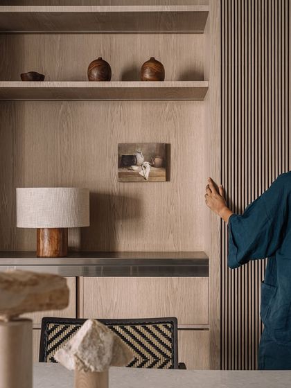 Another detail of the layered textures and materials in the Kanso House dining area, captured on a rainy day.