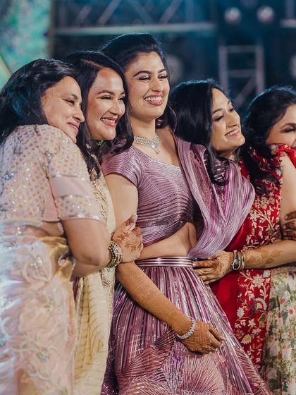 The love of a family is life’s greatest blessing. This beautiful moment captures the bride surrounded by the love of her family after a heartfelt group performance.