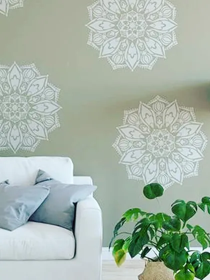 For a calm and spiritual ambiance, we used a large mandala stencil pattern on a soothing sage green wall. This type of decorative art is perfect for living rooms, meditation spaces, or yoga studios.