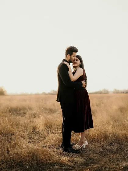 The golden hour light in this open field near Pune created a beautifully soft and warm atmosphere. My goal here was to capture the quiet comfort and deep affection between them, enveloped by the serene beauty of nature at dusk.