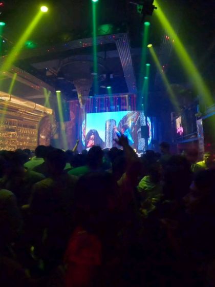 A wide shot of my AV set at Sugar Factory Reloaded. The green laser beams and the massive screen with custom graphics create an intense, club-like atmosphere that's perfect for a high-energy night.