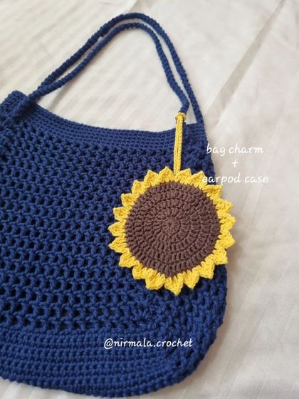 The sunflower attachment isn't just a charm, it's also a functional AirPod case or mini pouch.