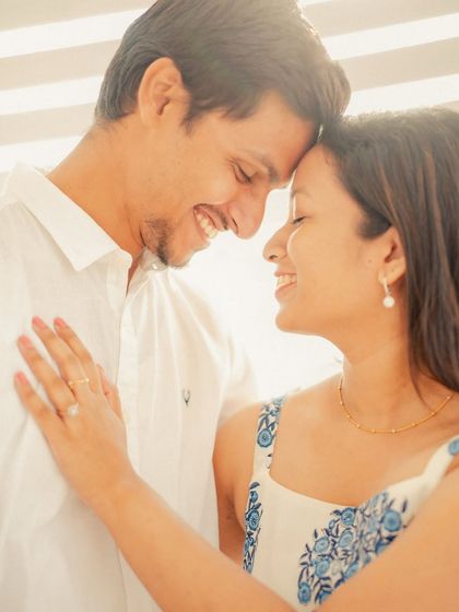 A bright, sun-drenched close-up of Annalisa and John. The high-key lighting creates a fresh and vibrant feel, perfect for capturing happy, intimate moments.