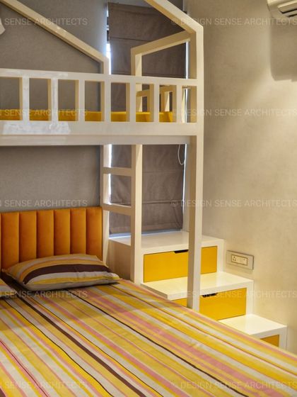 This angle shows the practical side of the bunk bed design, with integrated drawers in the steps for extra storage, proving that fun and function can go hand-in-hand.