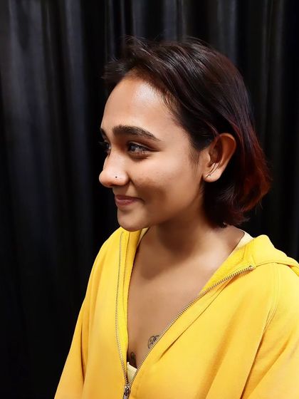 A smiling client with her new, subtle nostril piercing. I aim to make the piercing experience comfortable and positive.