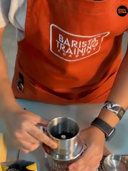 A trainer demonstrating how to use the Phin filter. We teach traditional brewing methods from around the world.