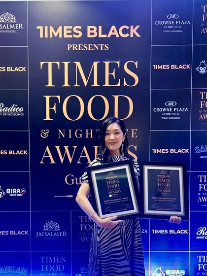 Our manager proudly holding our awards. This is a moment of gratitude for our amazing guests who have turned our tables into memories and every meal into a celebration.