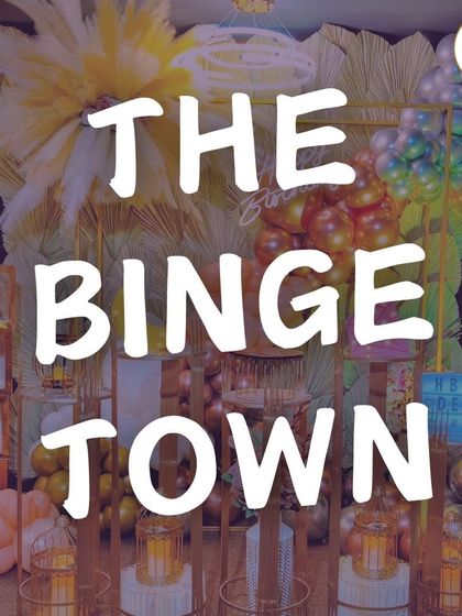 A vibrant and luxurious decoration setup, perfect for a grand birthday celebration. The mix of pampas grass, colorful balloons, and elegant pedestals shows the variety of high-end decor I can provide.