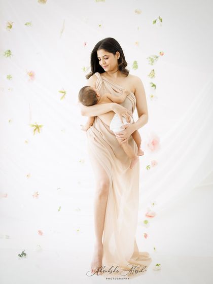 A full-length version of this serene portrait, showing the beautiful drape of the gown and the ethereal quality of the scene.