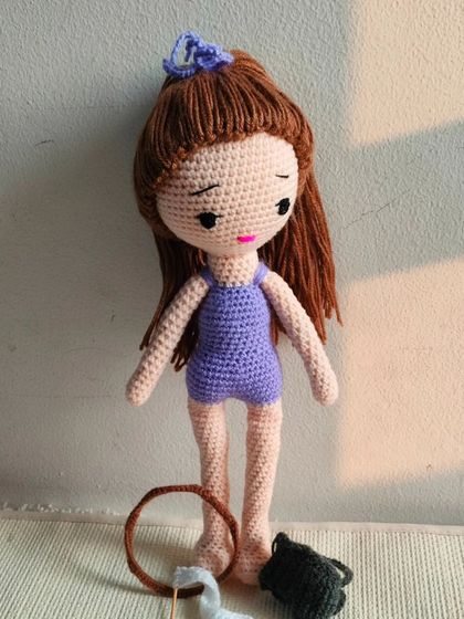 The gymnast doll without her accessories. Her simple purple leotard is also handmade.