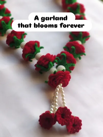My premium crochet rose garland is a piece that truly lasts forever. Each rose is crafted with vibrant red yarn and woven with delicate moti, making it a beautiful keepsake for weddings or to decorate your home mandir.