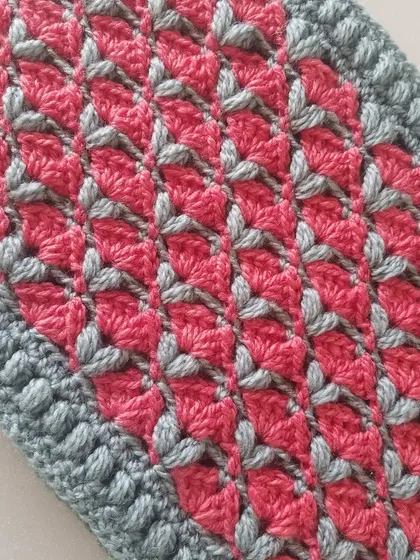 A flat shot of the Cardamom Blossoms cowl fabric, showing the repeating pattern clearly.