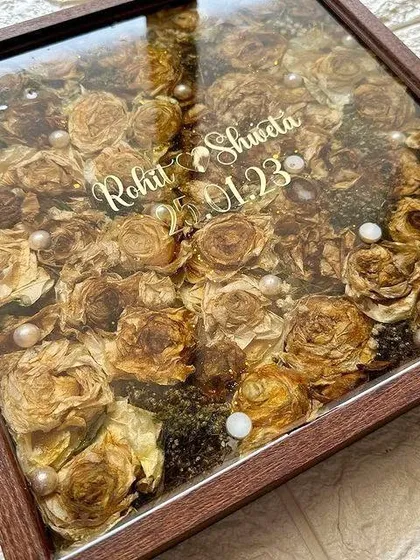 These images and videos showcase various angles and the creation process of my custom wedding and anniversary varmala preservation frames. Each one is made with love to turn your special memories into a timeless treasure.