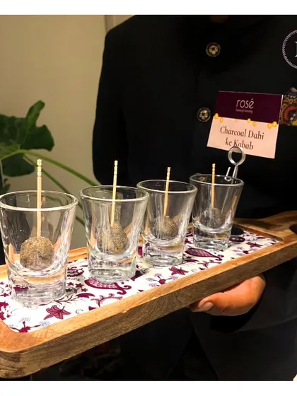 Our Charcoal Dahi Ke Kebab is a true innovation. Served in individual shot glasses, this dish combines smoky flavors with a creamy texture for a unique and memorable culinary experience.
