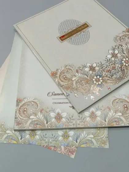 A sophisticated invitation with an intricate floral border and a clean, modern layout. The design is available with multiple inserts to match the elegant theme.