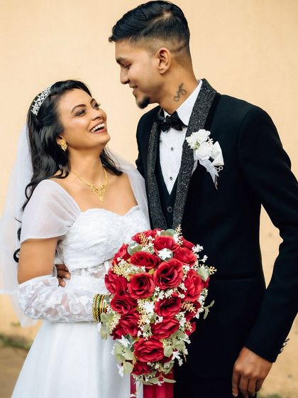 A joyful and candid interaction between the bride and groom. Capturing these moments of spontaneous laughter is a key part of my documentary approach.