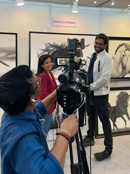 Behind the scenes during an interview with DD INDIA at one of my exhibitions. It is always a pleasure to share the story behind my charcoal artworks with the media.
