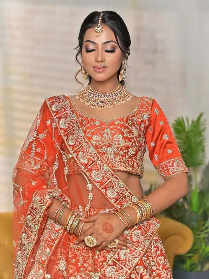 A full-torso view displaying the scale of the bridal jewellery against the lehenga. The statement ring is also visible, adding another layer of coordinated detail.