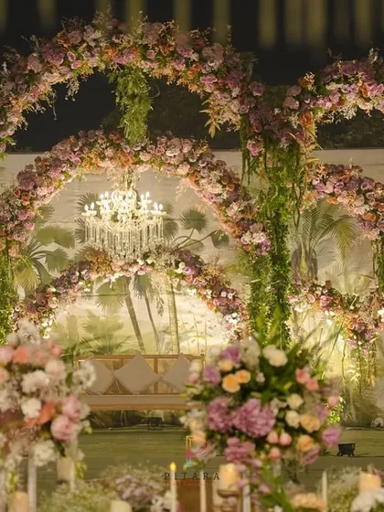 Another angle of the magnificent stage, showing how the layers of florals and lighting come together to create depth and drama.