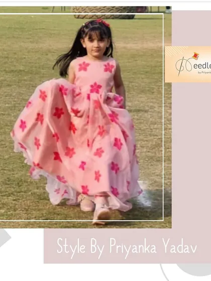 A closer look at the pink floral organza gown. This lightweight dress is perfect for daytime events, featuring a sleeveless design and a full skirt that is both beautiful and comfortable for active kids.