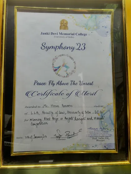 My certificate of merit for winning first prize in the Anjali Rangoli and Mehandi Competition at Janki Devi Memorial College in 2023.