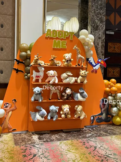 More than just a party favor, this "Adopt Me" wall is a heartwarming activity. Each young guest gets to choose and adopt their own plush animal friend, creating a memorable takeaway from the Lion King party.