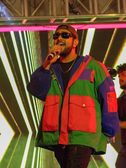 Shashwat Singh performing in front of a custom LED backdrop, part of our comprehensive stage design services.