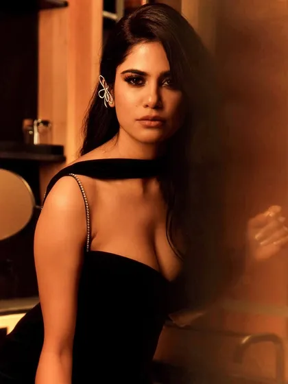 Another angle of the Aashram launch glam. This image captures the beautiful soft waves in her hair and the way the makeup catches the light, creating a radiant and sophisticated effect.