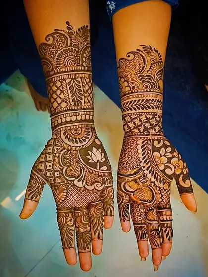Another view of the lotus and heart design, showing the full coverage on the hands.