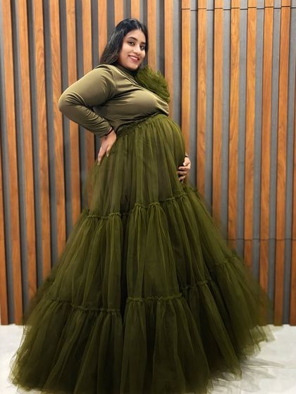 This olive green tiered gown is shown here in a family portrait, proving it's a wonderful choice for capturing moments with your loved ones.