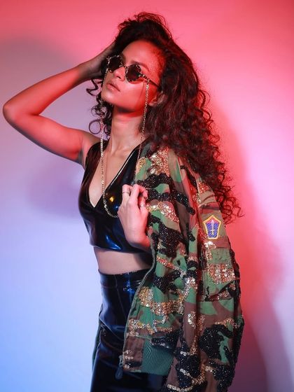 A dynamic pose against a colorful backdrop for a streetwear brand. We guide models to create movement and energy, resulting in photos that are perfect for engaging social media content and online stores.