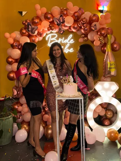Capturing fun moments is what it's all about! The bride and her friends enjoying the celebration with the custom decor.