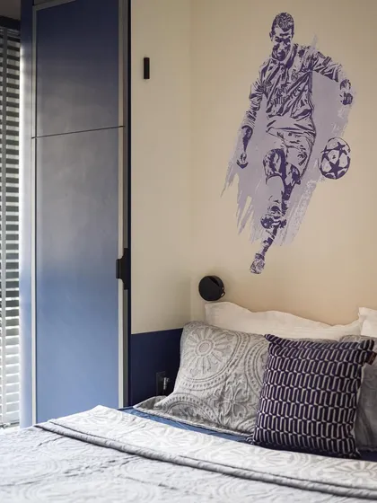 For the football lover, we added a custom wall decal. It's a simple but effective way to personalize the space and reflect the child's interests.