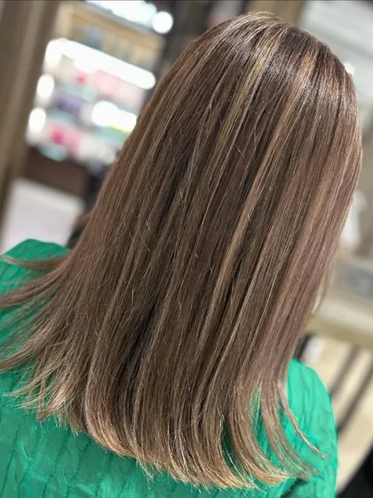 A hair color transformation to a cool blonde. I used blended highlights to cover grey and create this fresh, new look.