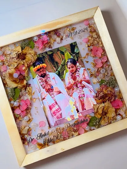 This is one of my favorite ways to preserve wedding memories. I take your beautiful varmala and a special photo, and seal them forever in this classic pine wood frame, creating a piece of art you can cherish daily.