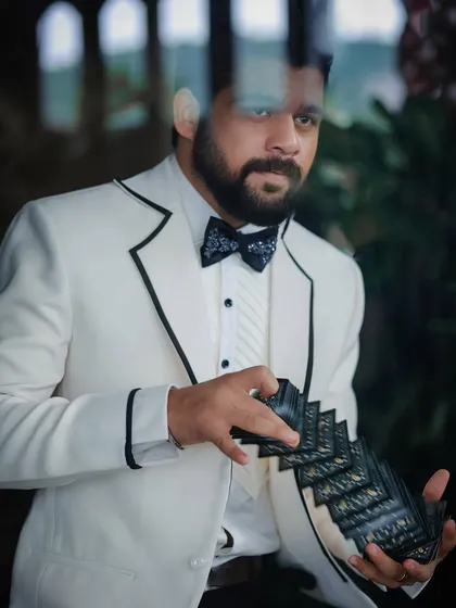 A close-up of the details, from the patterned bow tie to the fanned cards, all part of the character styling for Kshitish Date's shoot.