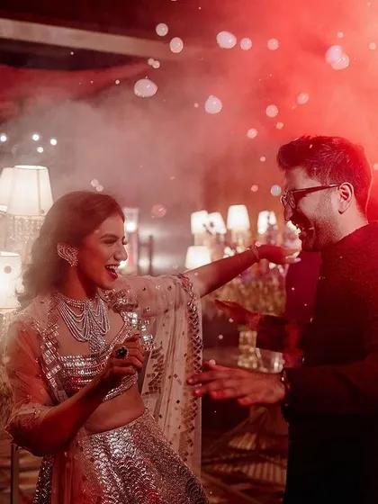 A Sangeet should be full of energy and joy. We design spaces that invite celebration, with dramatic lighting and an electric atmosphere that gets everyone on the dance floor. This moment captures the pure fun of the night.