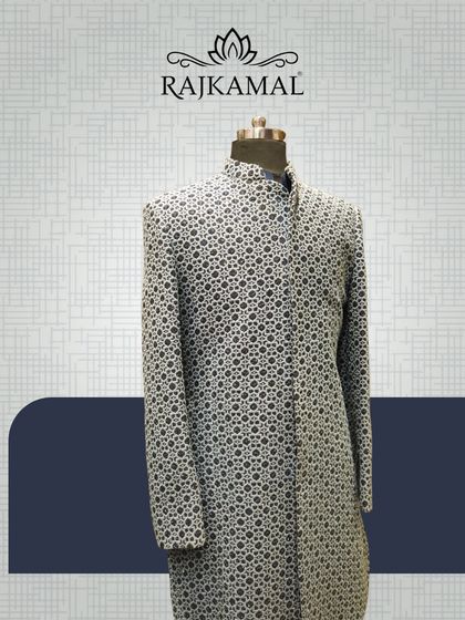 A full-length view of the black and white patterned sherwani-style jacket, a modern take on a classic silhouette.