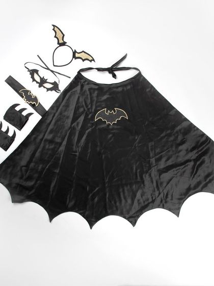 The bat costume cape spread out to show the bat emblem.