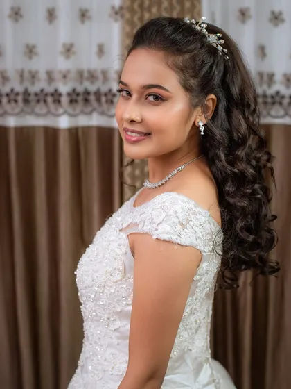 This classic white gown look was part of a student's portfolio. You'll learn to create hairstyles and makeup that perfectly complement any outfit.