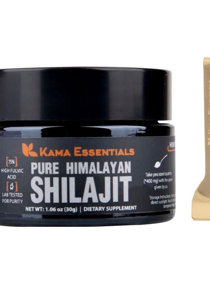 A shot of the Shilajit jar next to its custom golden spoon, highlighting the product's premium accessories.
