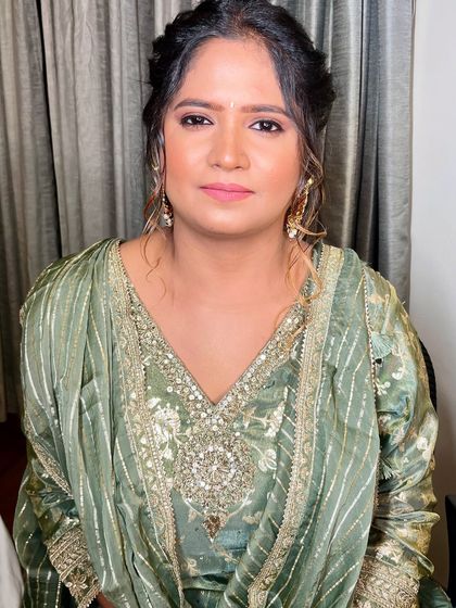 A happy and glowing bride-to-be. The minimal makeup allows her natural beauty and happiness to be the focus.