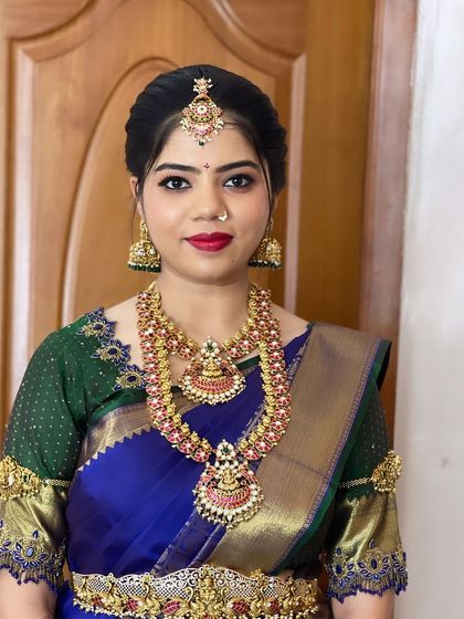 A straight-on shot that highlights the symmetry and precision of the makeup application.